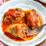 Slow Cooker Cabbage Rolls with tender cabbage leaves and savory ground beef filling in rich tomato sauce.