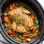 Juicy Crock Pot Turkey Breast served with golden skin and fresh herbs