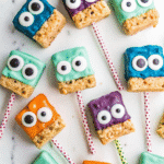 Colorful Monster Rice Krispie Treats with candy eyes on sticks.