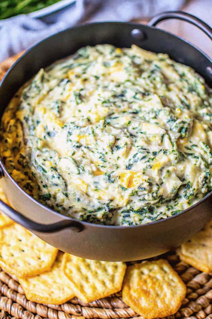 Close-up of Slow Cooker Spinach Artichoke Dip with melted cheese