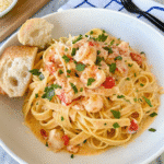 Creamy Easy Lobster Bisque Pasta with fettuccine, langostino lobster, Parmesan, and fresh parsley