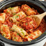 Crock Pot Unstuffed Cabbage Rolls in a slow cooker, showing tender cabbage, rice, and savory tomato-beef sauce.
