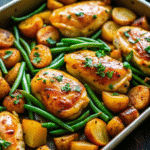 Sheet Pan Garlic Herb Chicken and Potatoes with golden roasted chicken, crispy baby potatoes, and tender green beans.