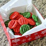 Colorful Christmas Cream Cheese Mints on a parchment-lined tray, ready to chill