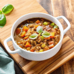 Slow Cooker Mexican Ham Soup in a bowl with red kidney beans, shredded ham, and a dollop of sour cream
