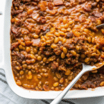 Hearty BBQ Baked Beans with Ground Beef in a baking dish, golden and bubbling with rich sauce.