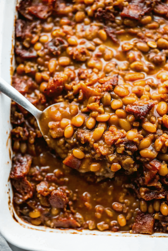 BBQ Baked Beans with Ground Beef Recipe 3 Oven-baked BBQ Baked Beans with Ground Beef, served hot with a glossy, caramelized finish.
