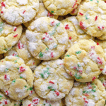 Christmas Ooey Gooey Butter Cookies fresh out of the oven, soft and buttery with red and green festive sprinkles.