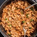 Slow cooked Crockpot Salsa Chicken shredded with salsa and lime.