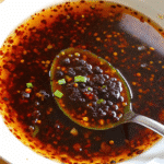 Creamy spicy wet sauce in a small bowl with a smooth, glossy texture