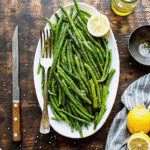 Air fryer basket filled with crisp-tender green beans lightly seasoned and roasted to perfection.