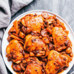 Juicy Instant Pot chicken thighs glazed in balsamic-honey sauce, garnished with fresh parsley.