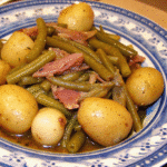 Slow Cooker Green Beans and Ham and Potatoes served in a bowl with tender green beans, baby potatoes, and savory ham