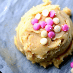 Valentine Day Cookies Recipe decorated with pink dough and heart-shaped sprinkles on a baking tray