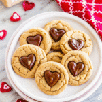 Plate of soft and chewy Peanut Butter Valentine Day Cookies decorated with colorful Valentine’s sprinkles.