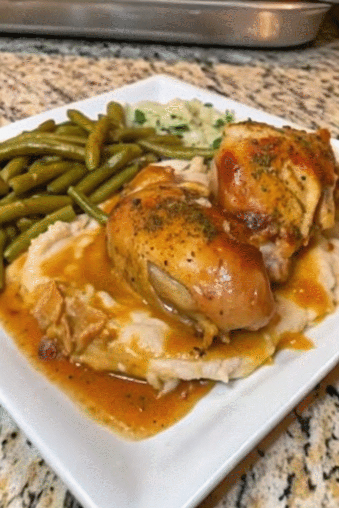 Close-up of Crockpot Smothered Chicken Legs in a rich, creamy sauce