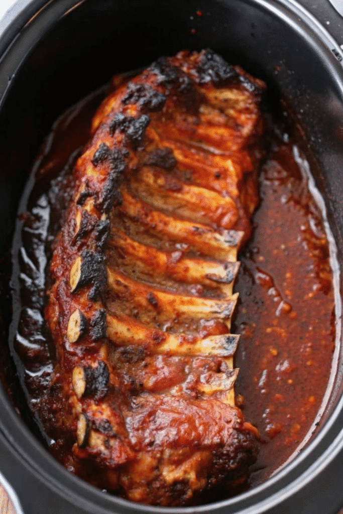 Close-up of caramelized BBQ slow cooker baby back ribs ready to serve