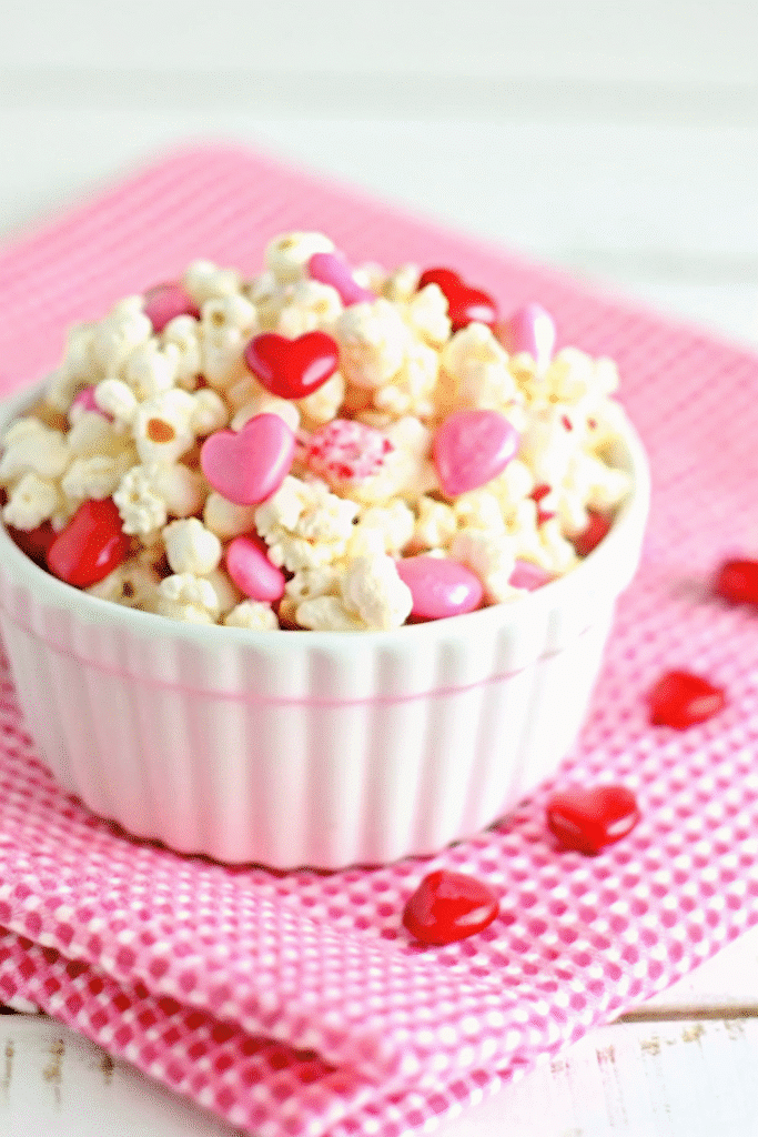 Valentine Day White Chocolate Popcorn Recipe In 15 Min 3 Homemade Valentine Day White Chocolate Popcorn with kettle corn, pink chocolate coating, and Valentine sprinkles