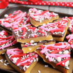 Colorful Valentine Crack candy with chocolate and pink, red, and white candy drizzle topped with festive Valentine sprinkles.