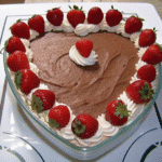 Valentine Berries and Cream layered dessert with chocolate mousse, whipped cream, and fresh strawberries in a glass
