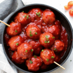 Cranberry Sauce Meatballs simmered in a sweet and savory cranberry chili glaze