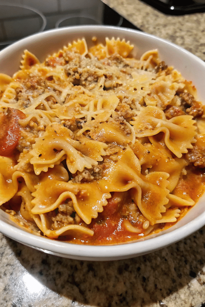 Close-up of Creamy Velveeta Beef and Bowtie Pasta with cheesy sauce and Rotel tomatoes