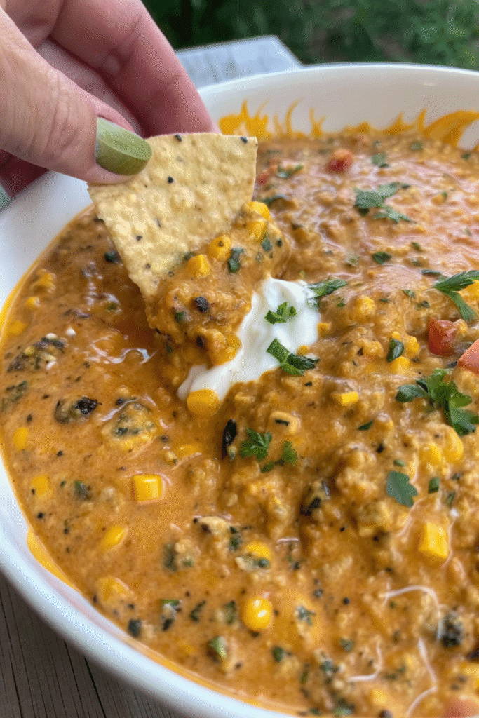 Skillet of Tex-Mex Beef Queso Dip with ground beef, cheese, and Rotel tomatoes