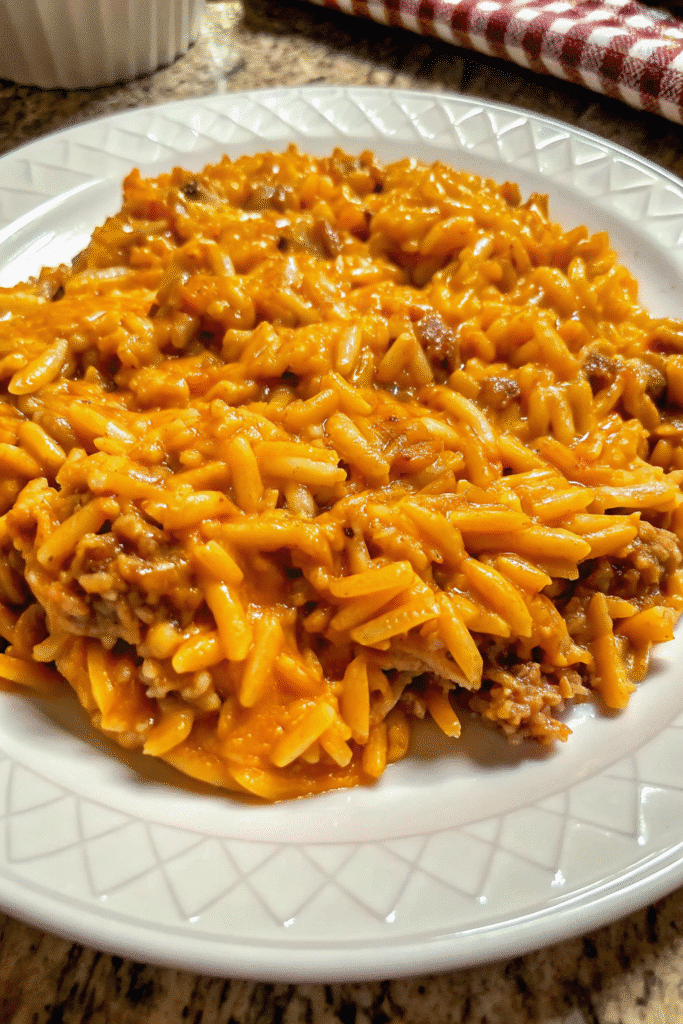 One-pan Cheesy Cheeseburger Orzo Skillet topped with golden melted cheese