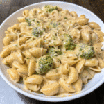 Crockpot Chicken Broccoli Mac and Cheese in a slow cooker, showing creamy pasta, tender chicken, and bright green broccoli.