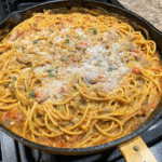 Bowl of Homemade Creamy Spaghetti topped with Parmesan cheese and parsley