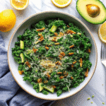 Fresh Parmesan Tahini Kale Salad with shredded parmesan and crunchy croutons in a large bowl