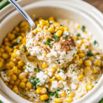 CrockPot Street Corn Chicken with creamy chicken, sweet corn, queso fresco, and cilantro in a slow cooker.
