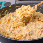 Creamy Chicken with Egg Noodles served in a bowl with tender chicken, egg noodles, carrots, and rich homemade cream sauce.