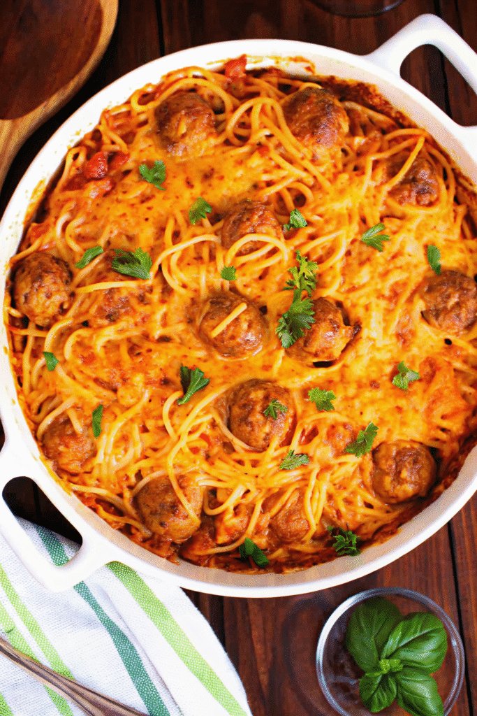 Close-up of Leftover Spaghetti baked with Parmesan and cheddar, served warm and golden.