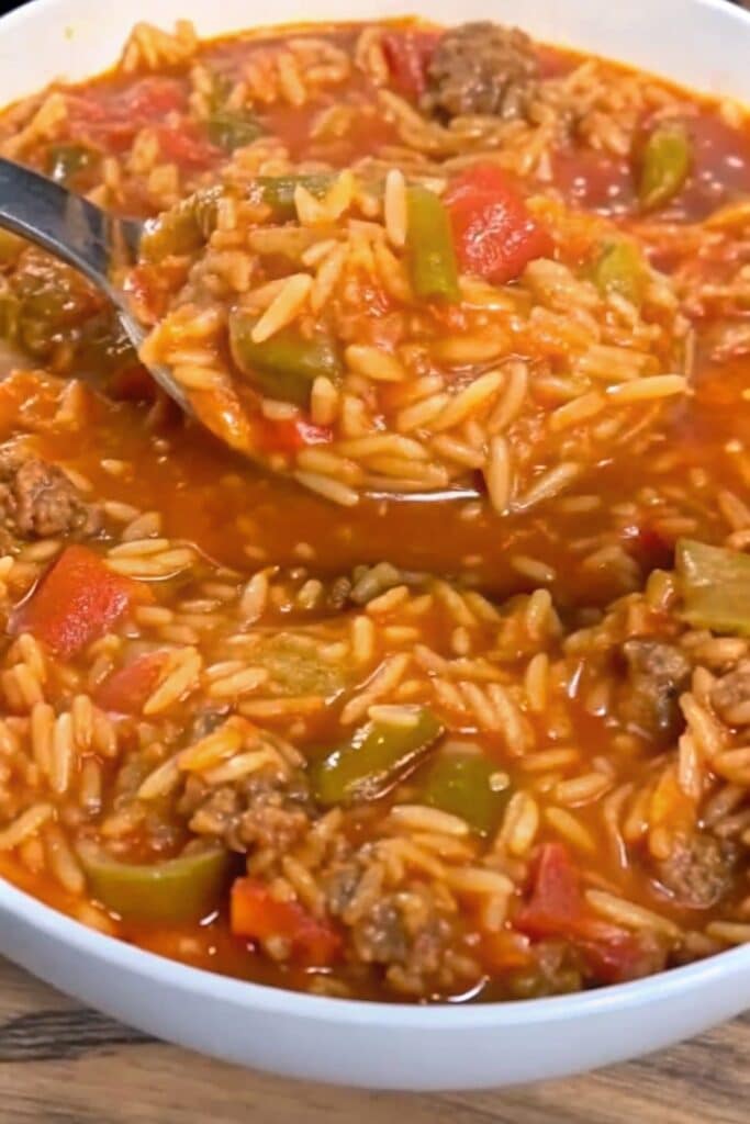 Cheesy Stuffed Pepper Orzo Skillet served hot with seasoned ground beef, diced bell peppers, tomato sauce, and tender orzo pasta.